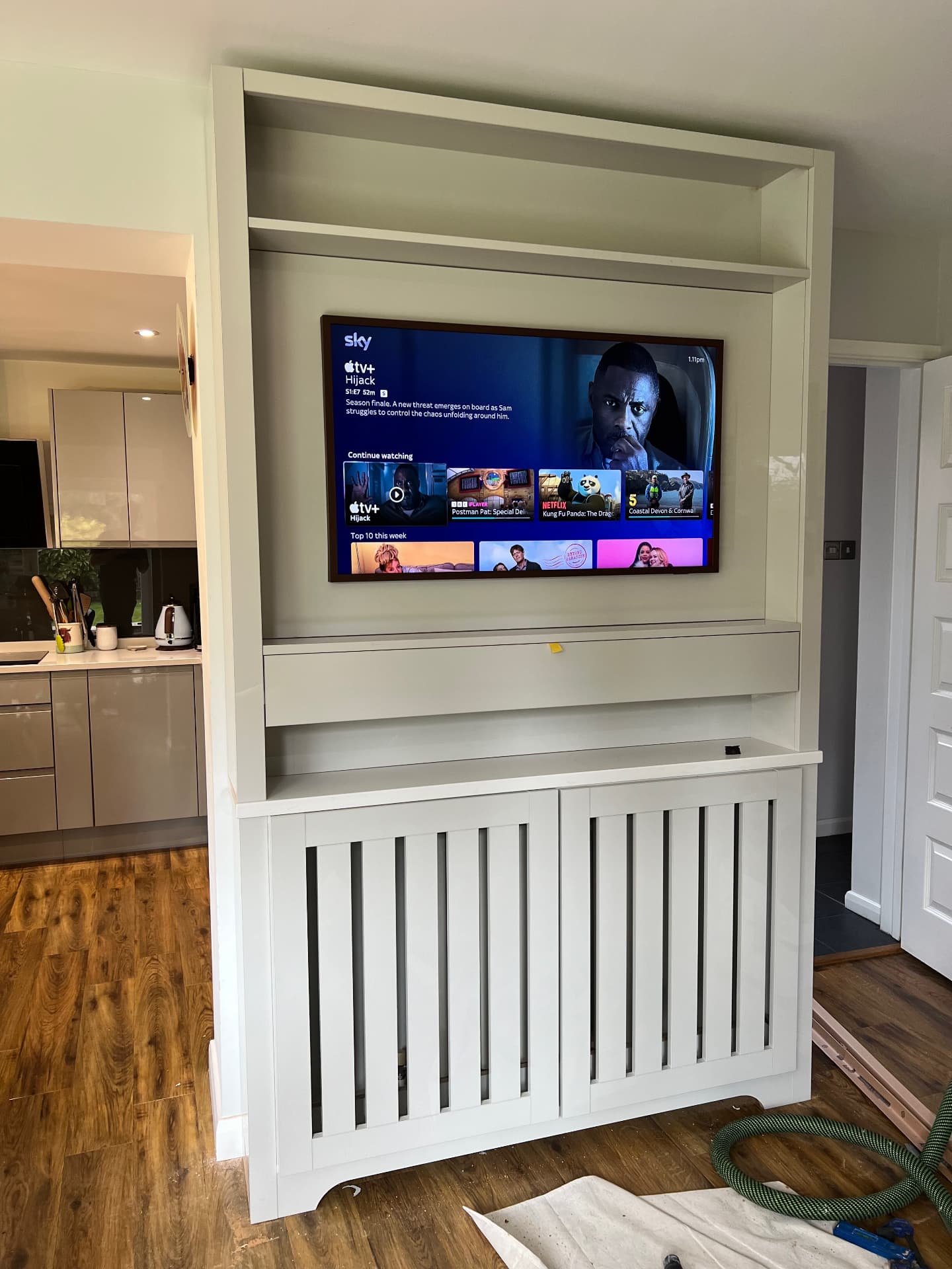 TV mounted and slatted radiator doors fitted during final assembly