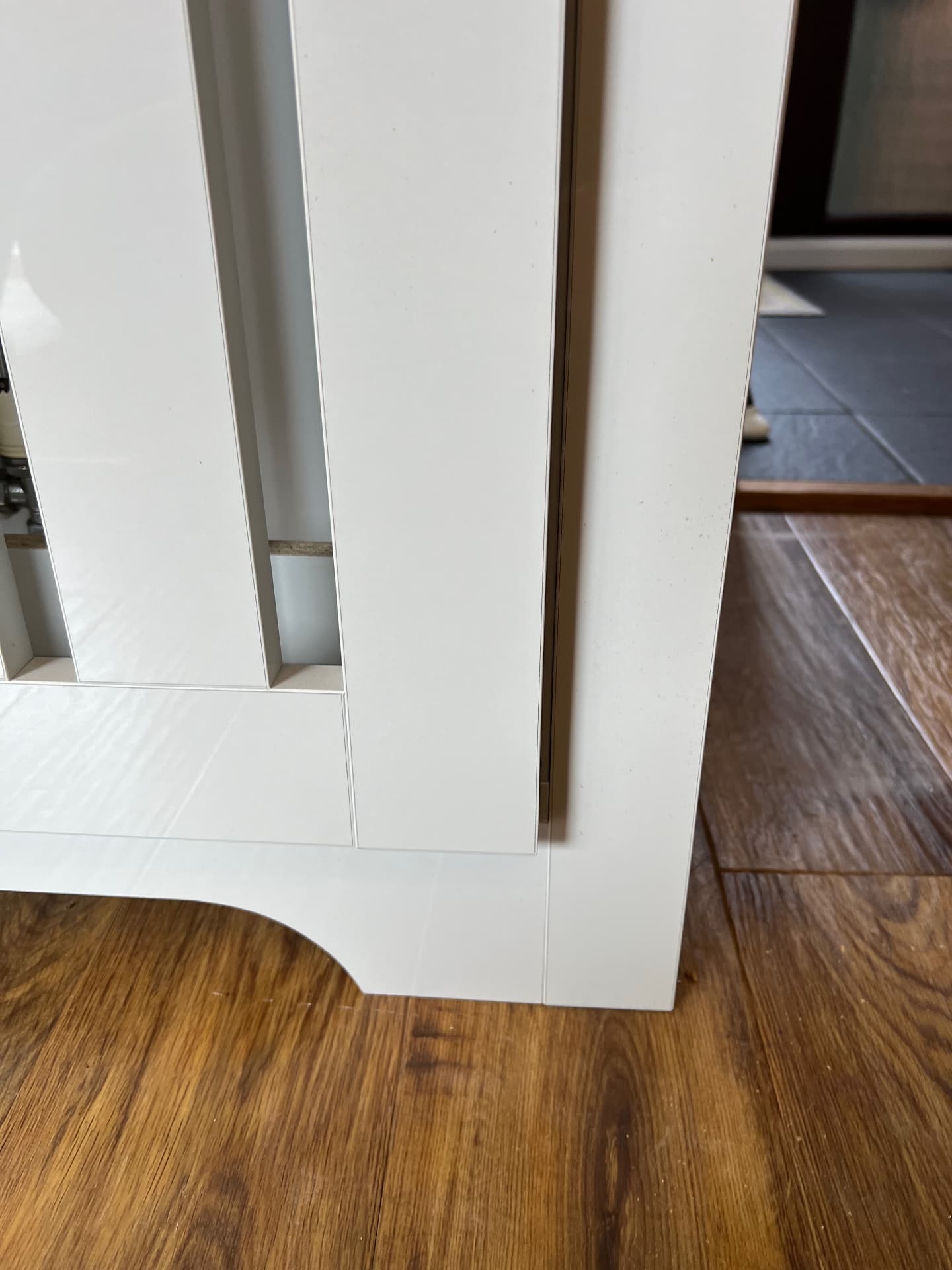Scribed plinth detail at the base of the unit