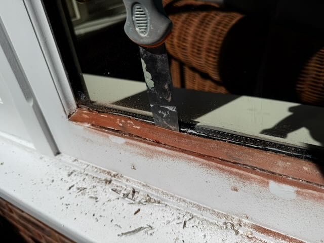 Removing loose material along the glazing edge