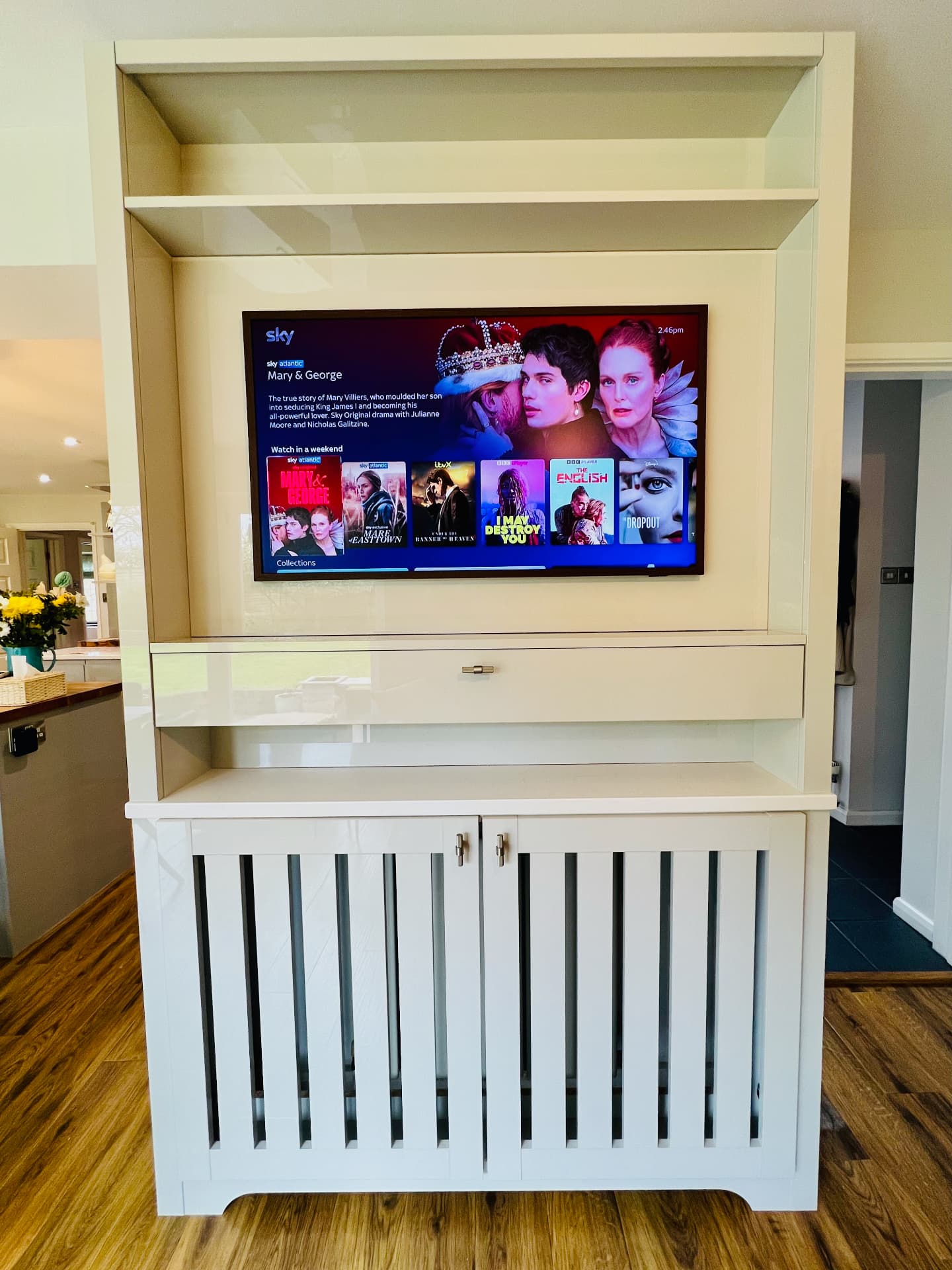 Completed media unit with TV on and display shelf above